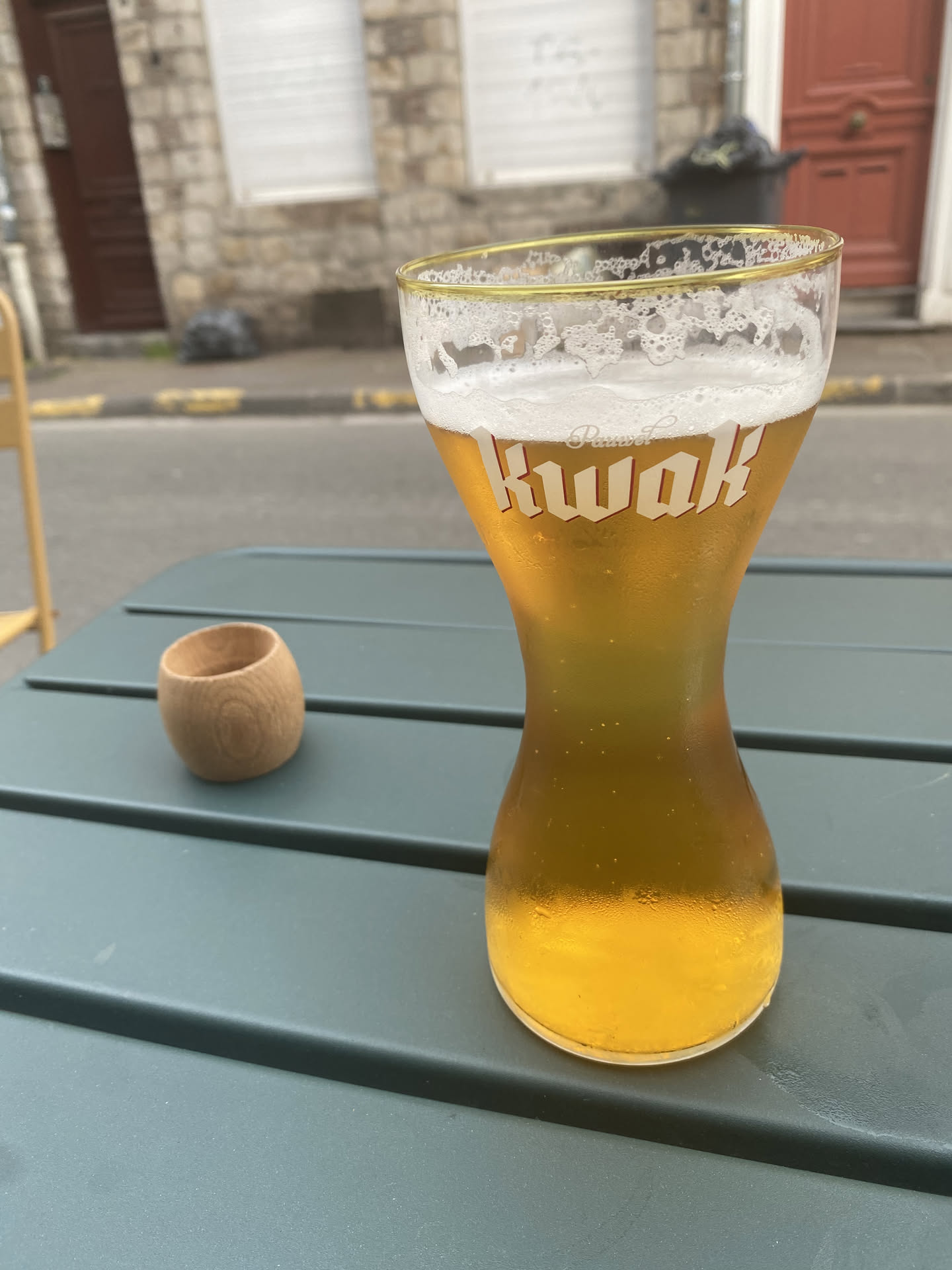 kwak in an hourglass shaped cup